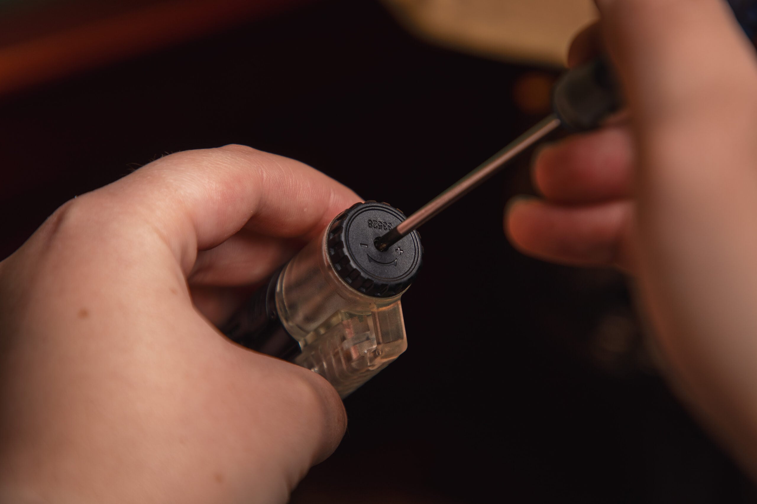 bleeding a cigar lighter with a small screwdriver