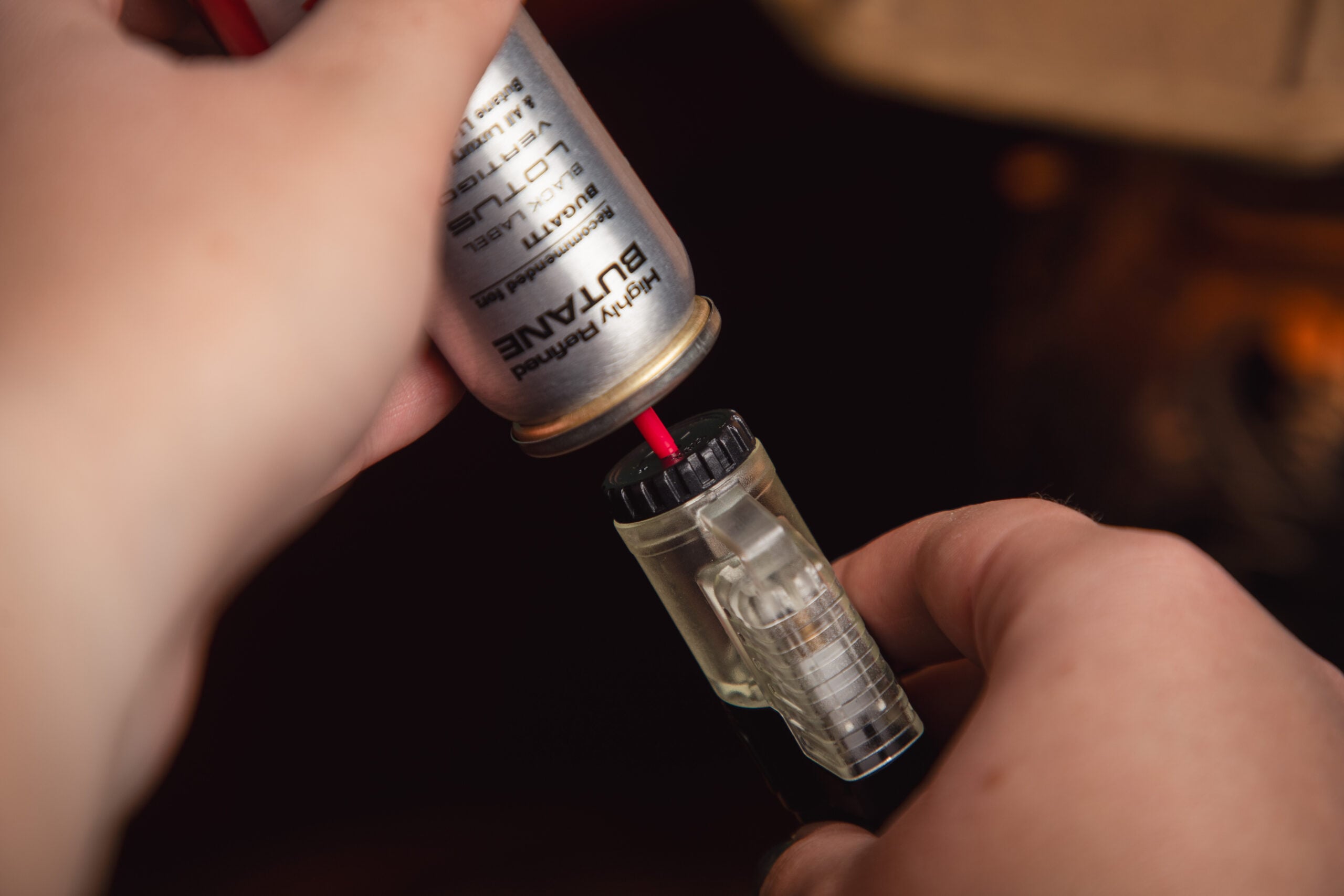 filling a cigar lighter with butane