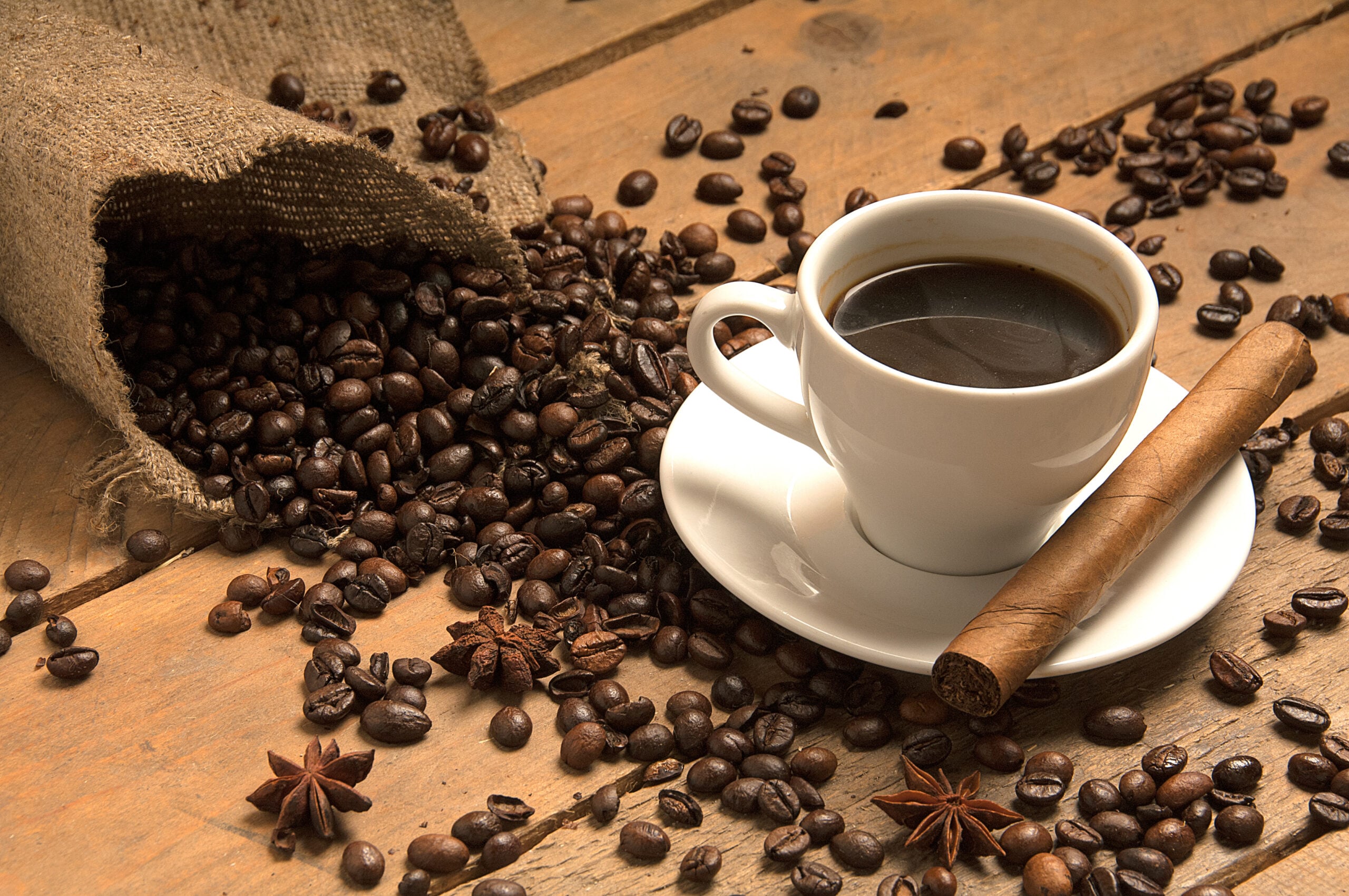 cigar, coffee, and coffee beans displayed together